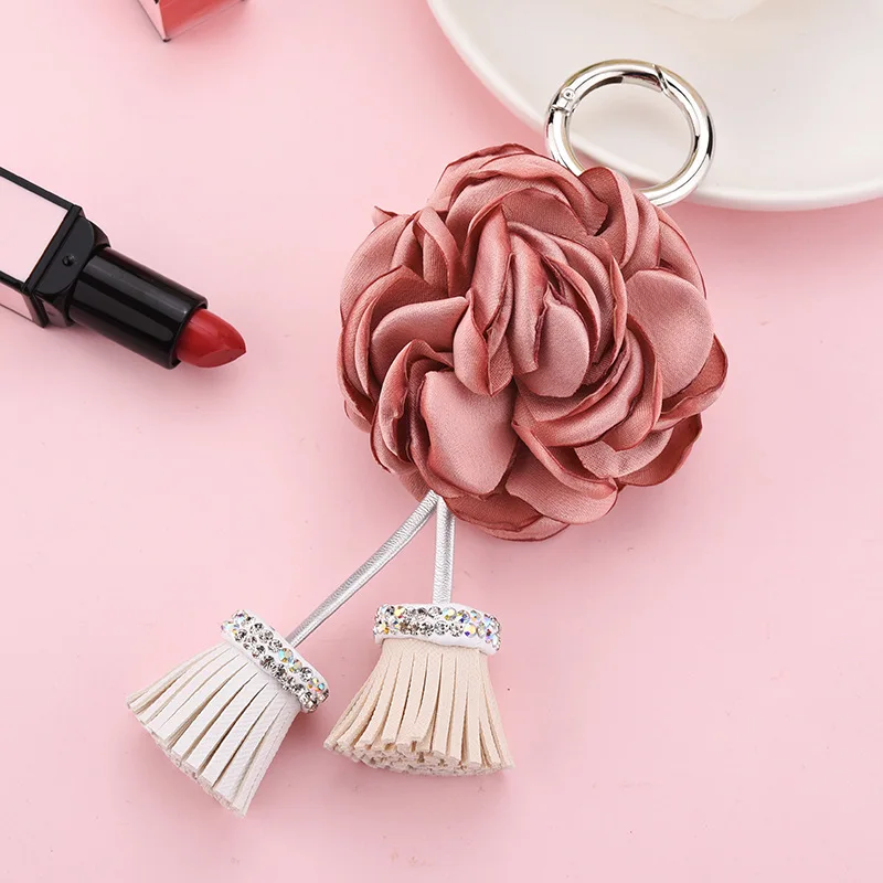 2021 Korean version of the hanging edge burning hot flower bag pendant jewelry female diamond PU tassel alloy key chain manufacturers