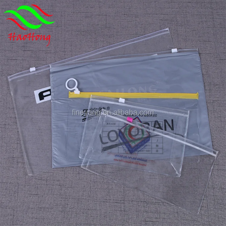 Wholesale clear soft vinyl pvc cosmetic zipper pouch/Plastic standing pvc zipper pouch bag with tear notch for snack