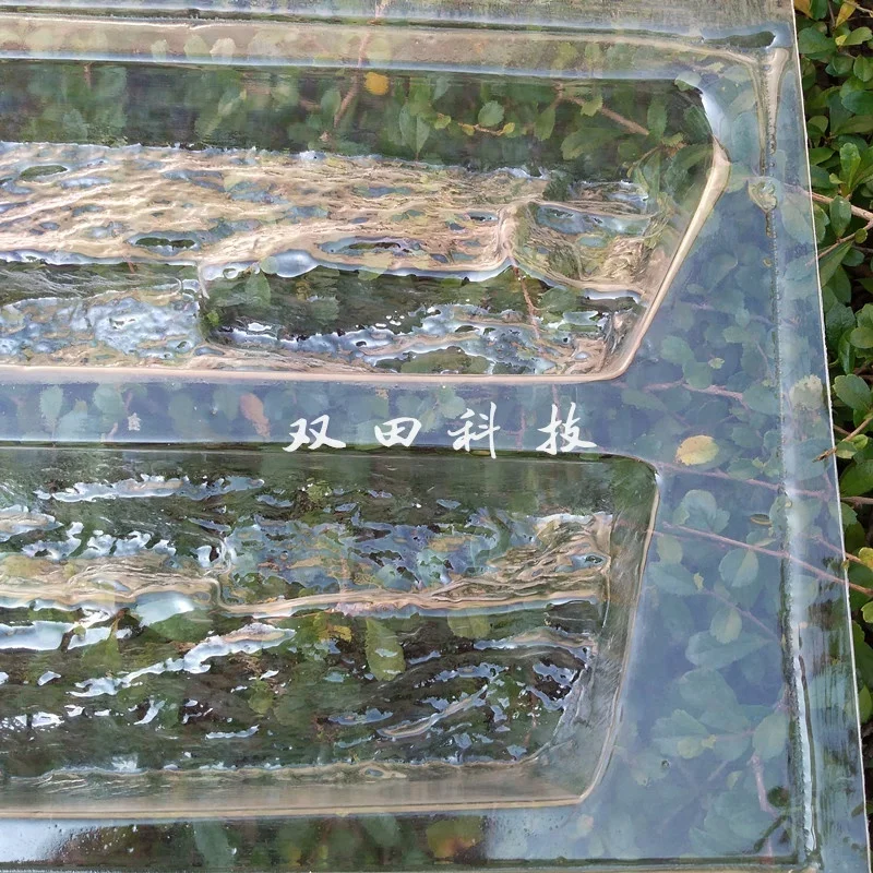 Factory-supplied vacuum formed plastic panel for making 3D cement brick tile recyclable and economical