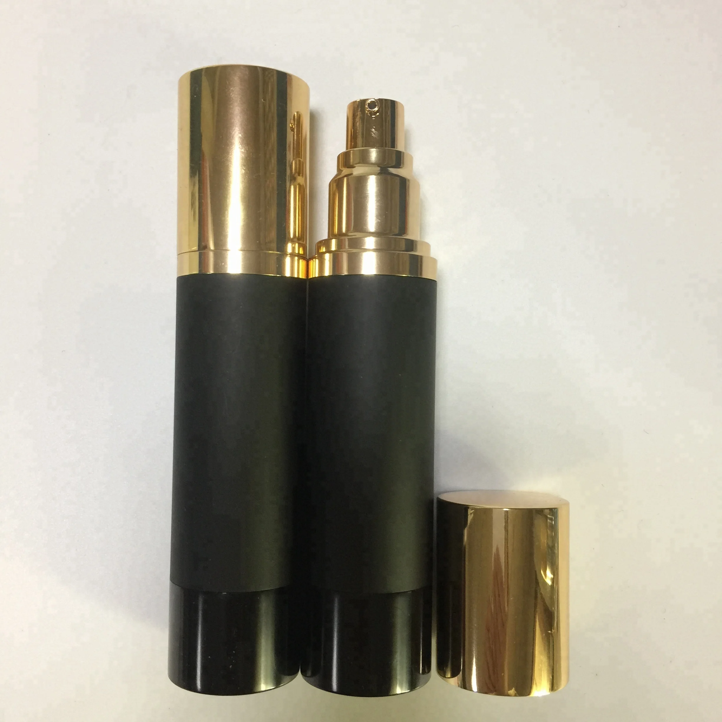 low MOQ matte black airless round aluminum bottle with golden lotion pump spray pump