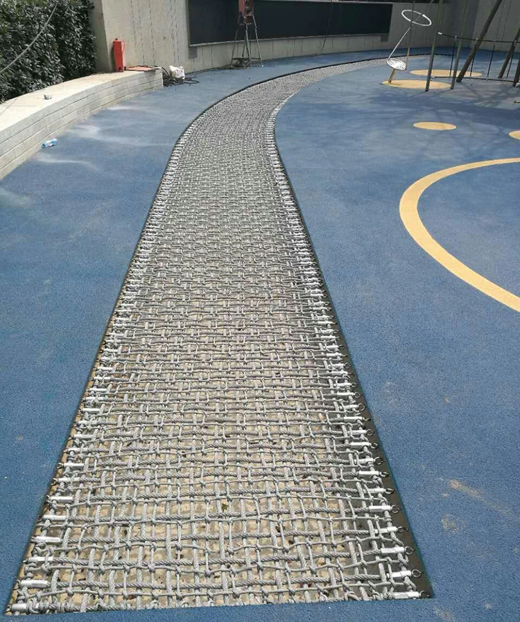 Long outdoor rope net in ground trampoline for park