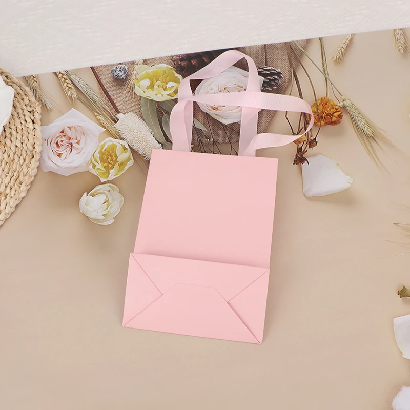 guangzhou factory make pink paper gift shopping bag paper luxury boutique package bags for clothes