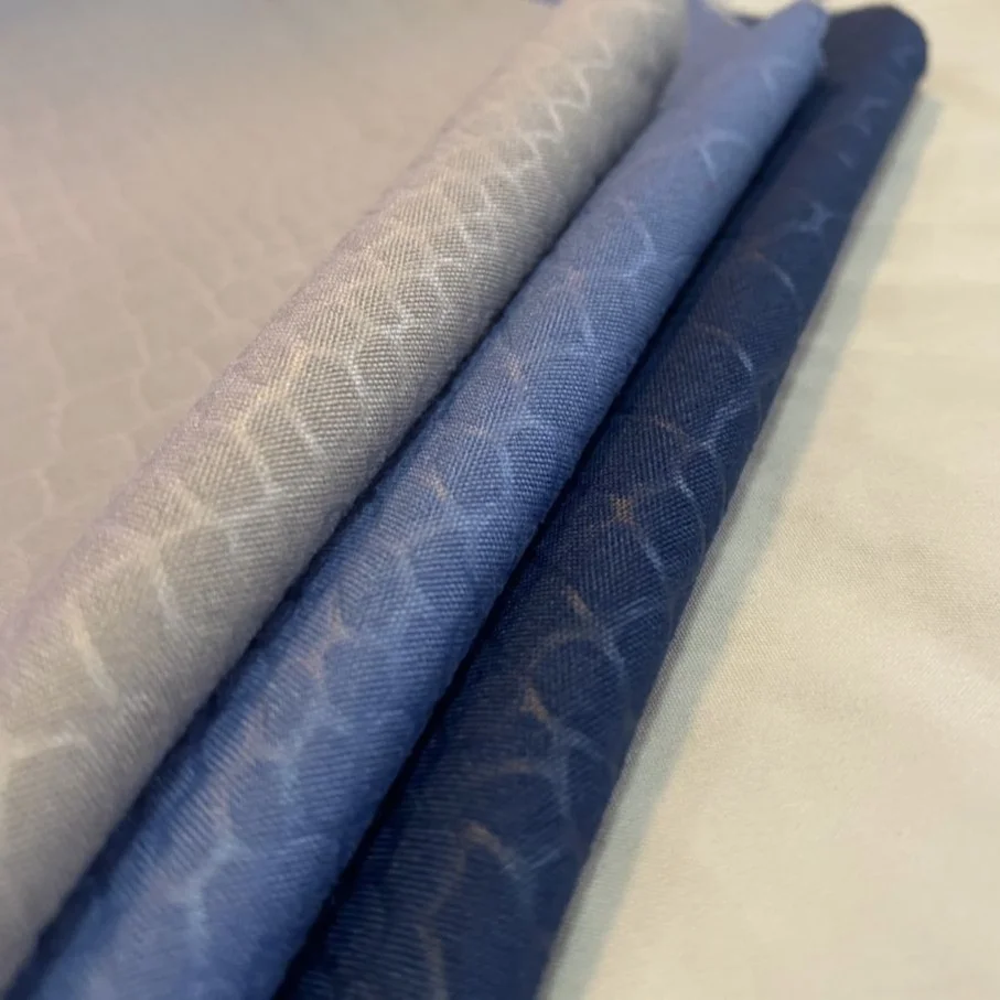 Wholesale 100% polyester stretch knit Dyed Embossed cheap embossed printed fabric for garments