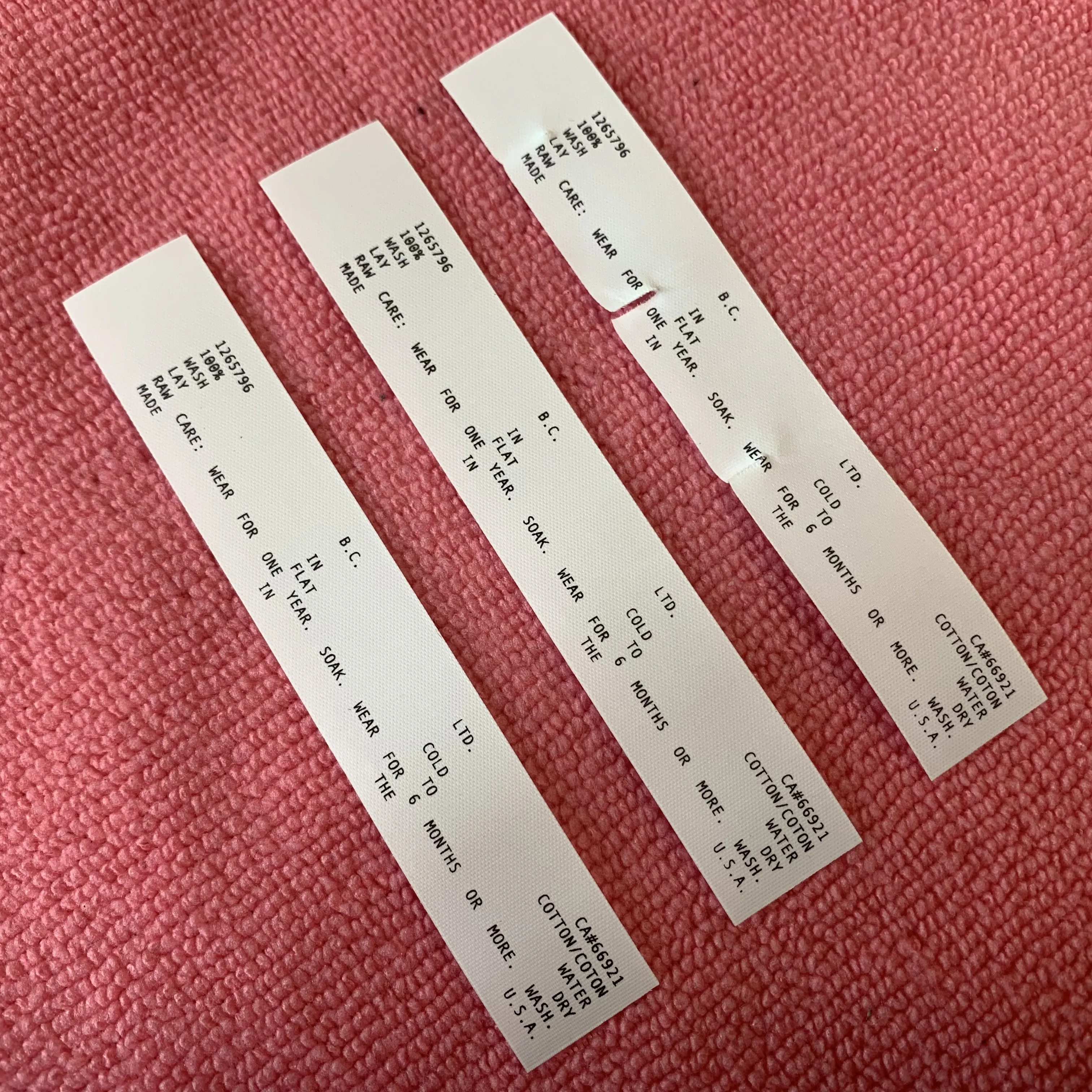 peel off washing instruction black tearaway fabric label,free sample tear away washing tags