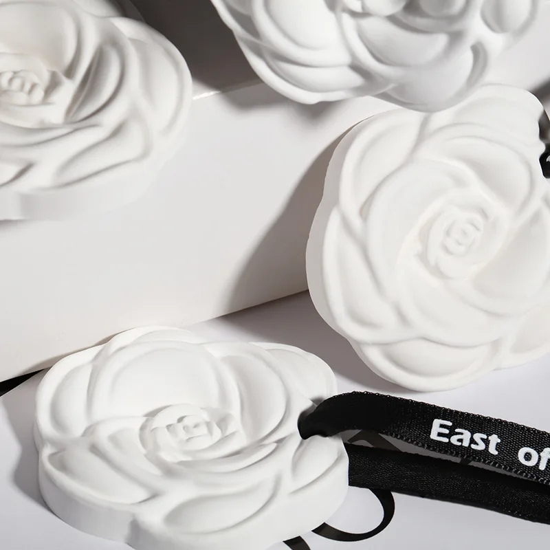 Wholesale camellia car aromatherapy hanging piece home wardrobe aromatherapy wax piece gypsum scented piece air freshener