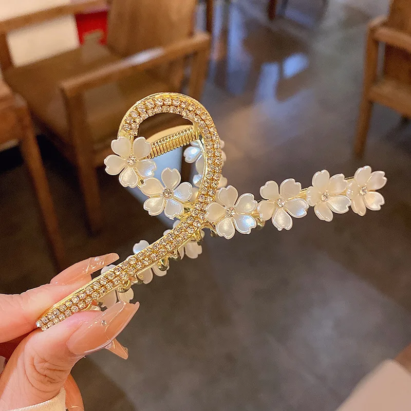Shuoyang factory Korean fashion metal flower clutch clip female summer super fairy rhinestone back of the head hair accessories