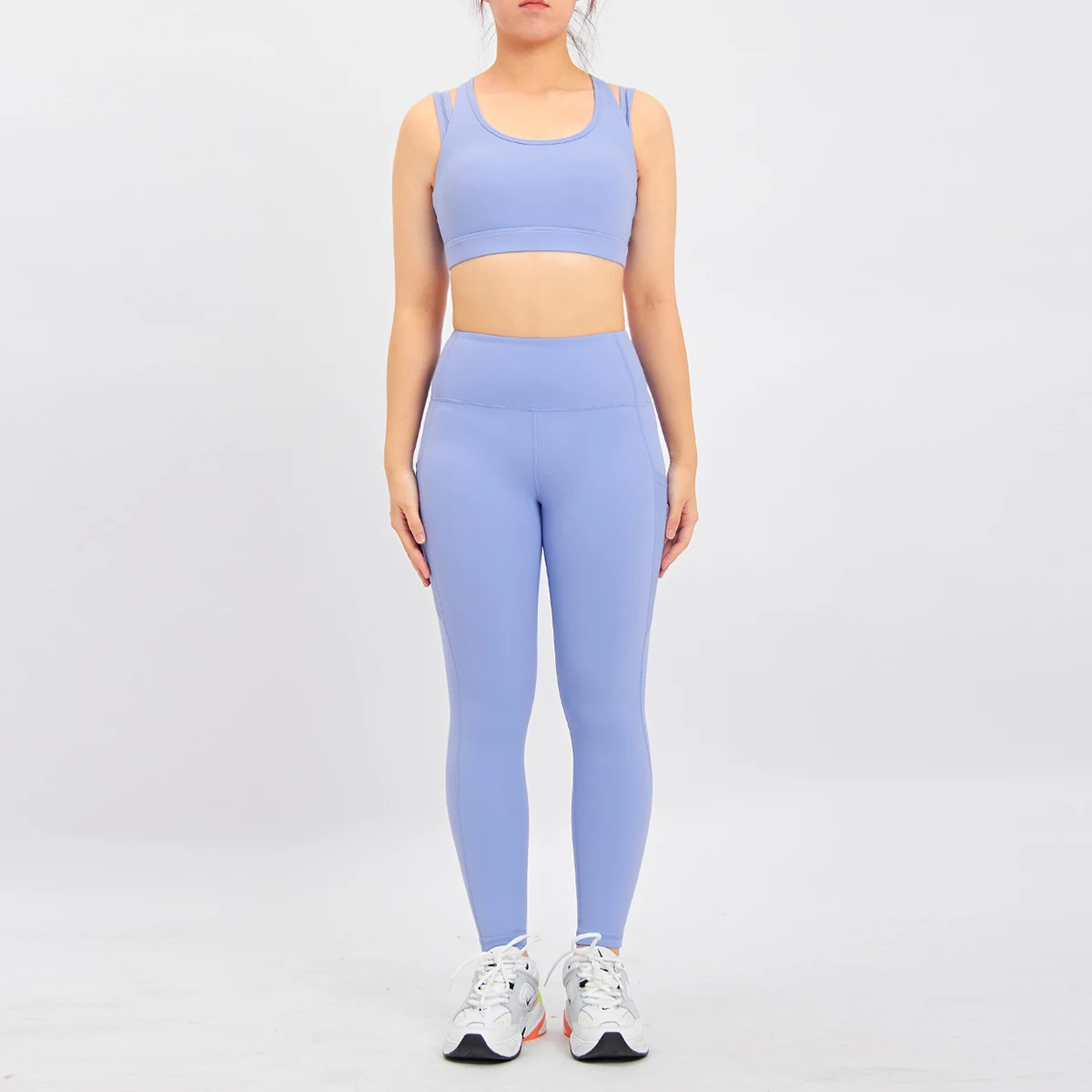 OEM Garment Factory  Ladies Fitness Workout Apparel Premium Stretchy Mesh Pocket Nylon Gym Leggings And Sports Bra Yoga Sets