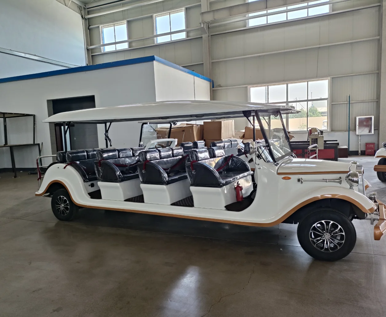 The square-head vintage classic car with golden trim in pure white, offering 6-14 seats,  and equipped with a lithium battery.
