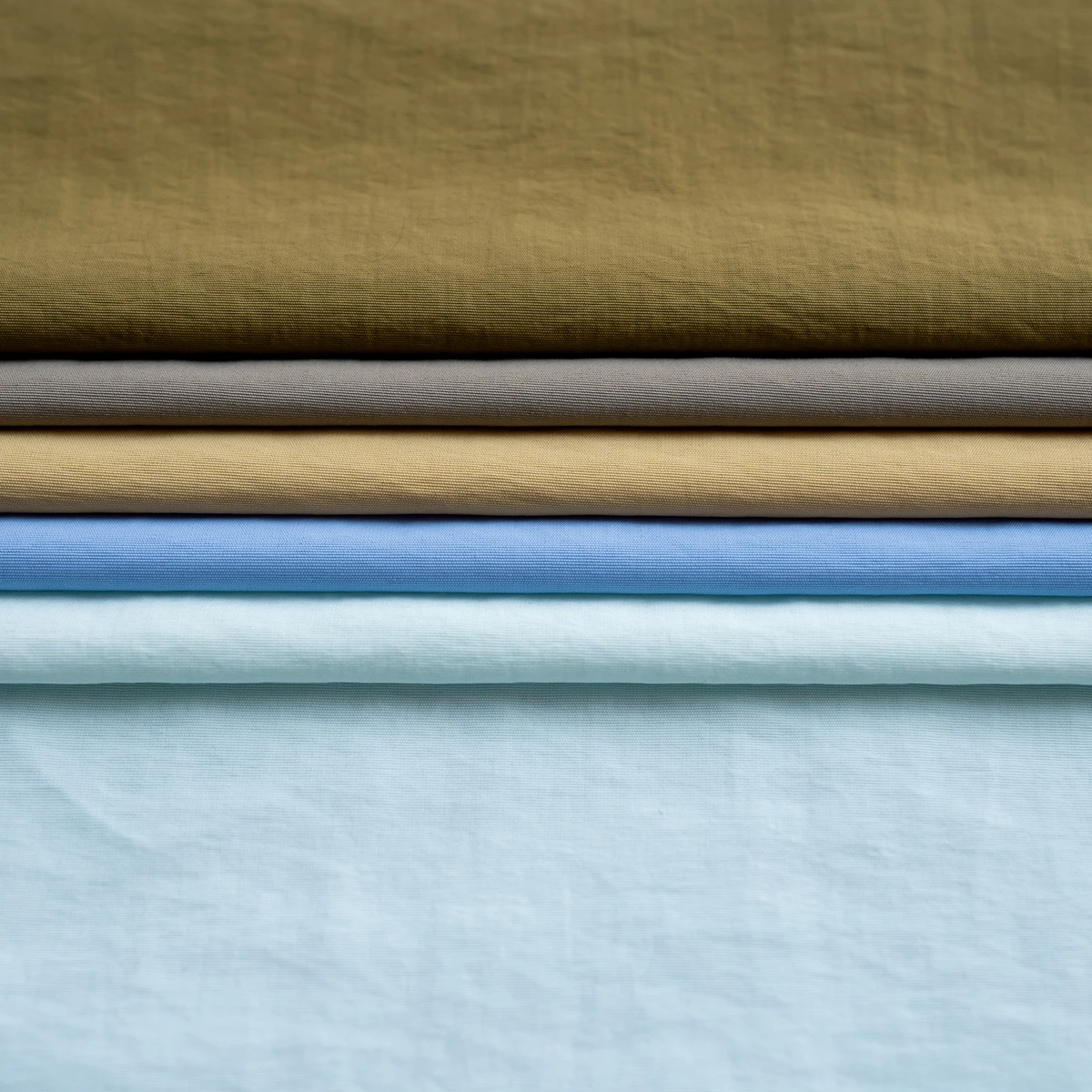 Manufacturer custom plain solid 100% nylon fabric textile cotton like soft jaket fabric taslon fabric for winter jacket