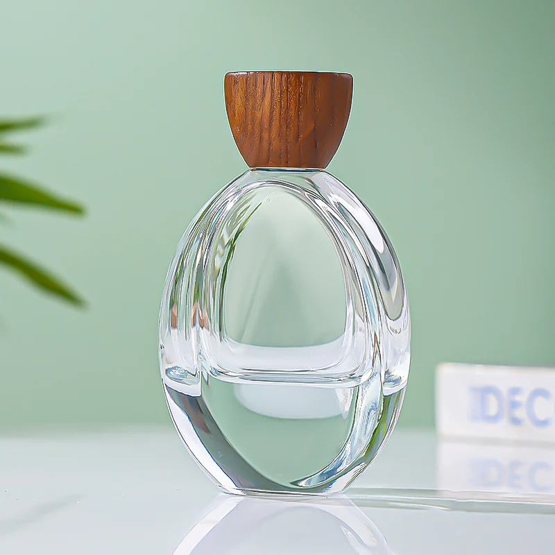 Luxury Custom Transparent Oval Perfume Bottle 50ML Thick Bottom Cologne Water Bottle Wooden Cover Perfume Spray