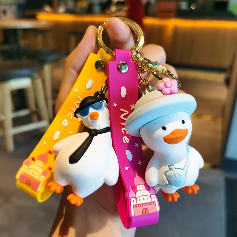 Wholesale cartoon cute funny duck soft rubber pvc keychain girl schoolbag pendant crystal key chains