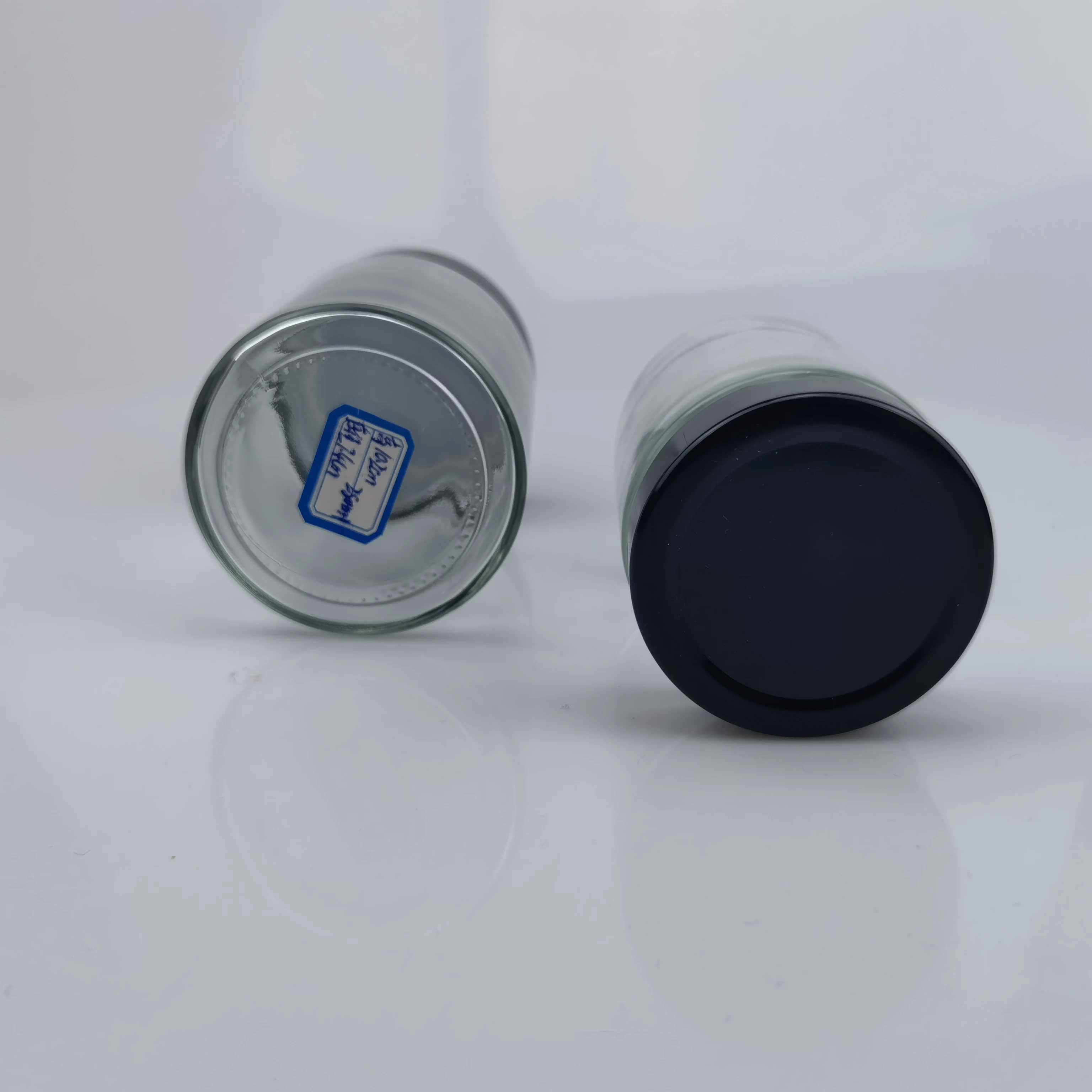 Factory price 100ml 140ml 180ml 200ml 220ml 280ml 212ml Round Shape Ergo Honey Glass Jar with Twist Metal Lid