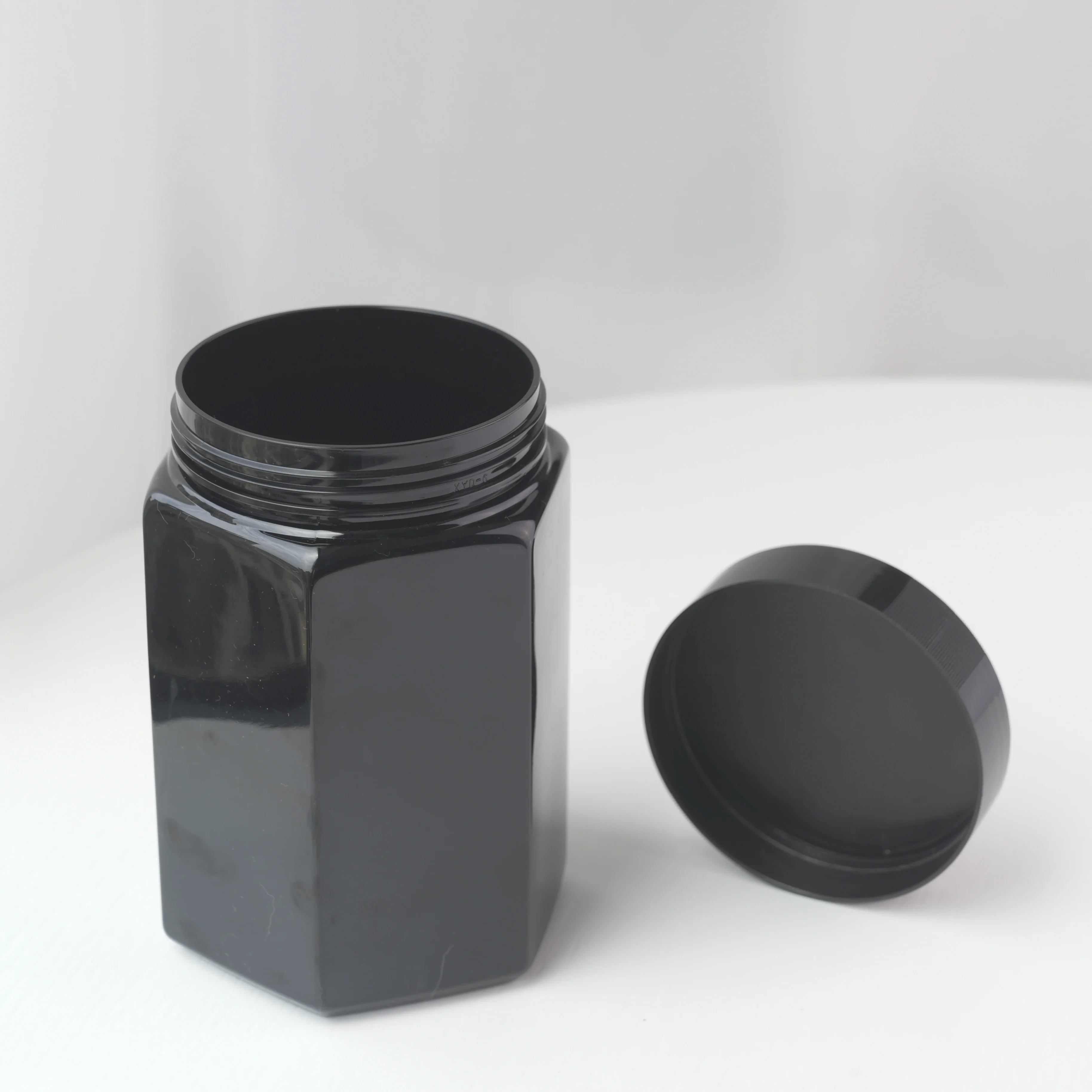 Wholesale amber color hexagon shape 500g 1000g pet plastic honey jar with Airtight Lids
