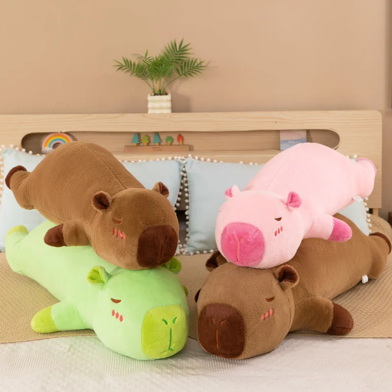 The capybara pulls the pillow for girls to sleep on the bed and holds the sleeping doll long pillow plush toy