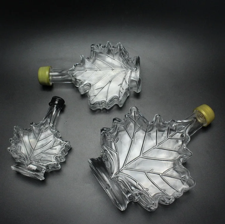 Hot sale wine juice pack 50ml 100ml diffuser perfume mini glass maple leaf bottles with cork