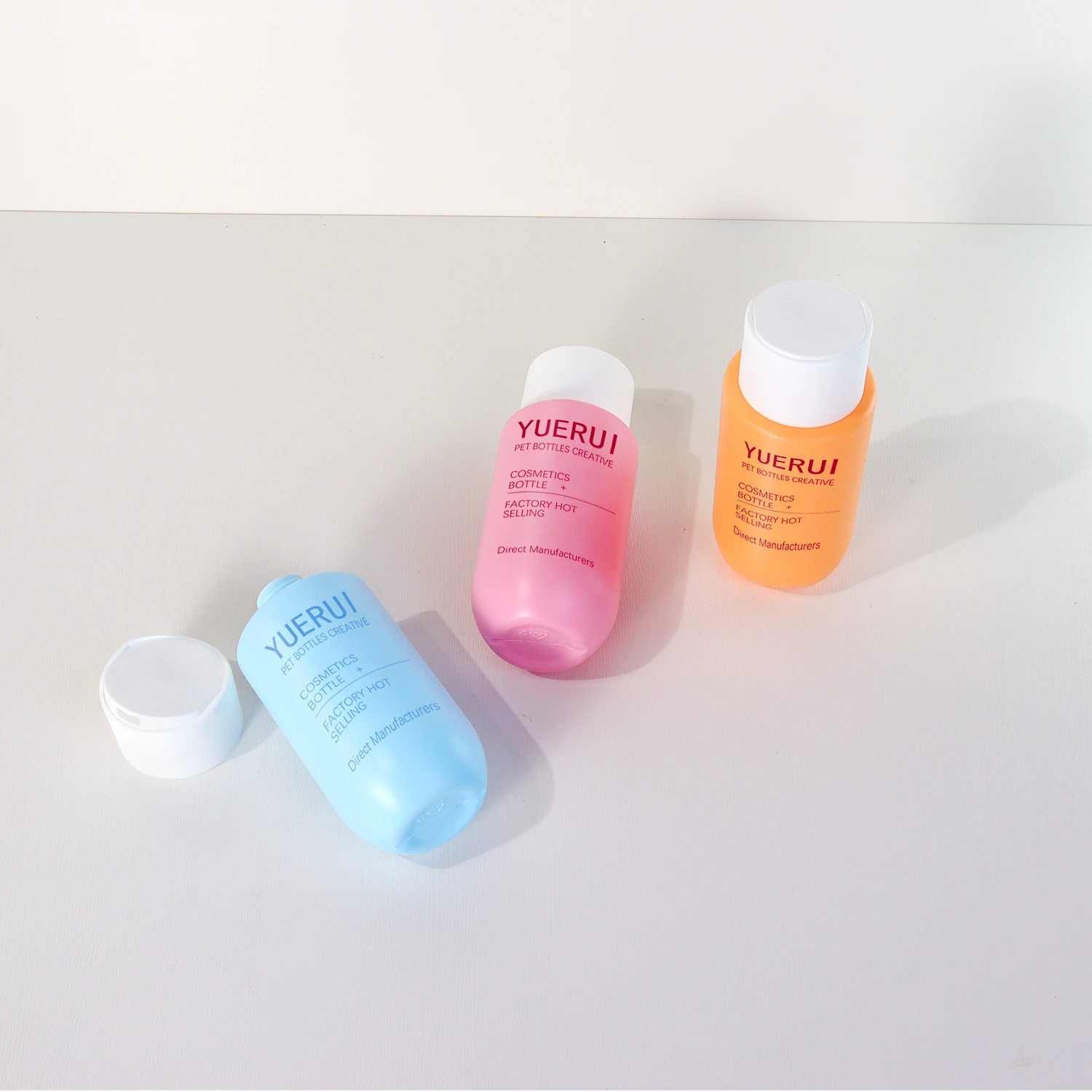 100ml Hot selling small capacity Qianqiu cover round bottom shampoo shower gel conditioner squeeze PE plastic soft bottle 90ml