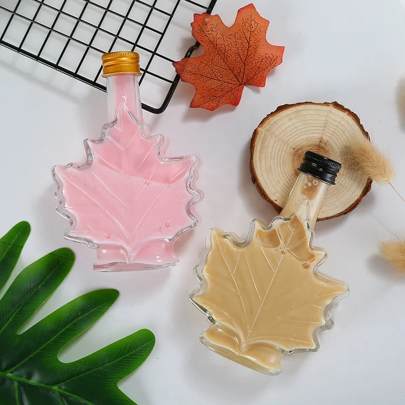 
Unique 100ml Maple Leaf Shaped Glass Bottle Glass Beverage Bottle Dark Rum bottle with Screw Cap 
