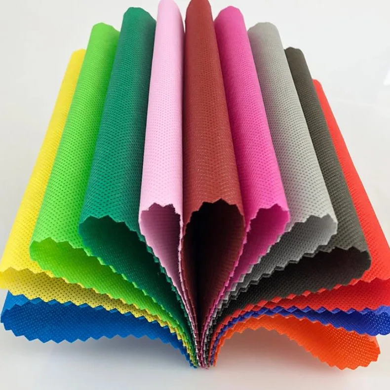 Wholesale High Quality Raw Material Polypropylene 100% PP Spunbond Non Woven Fabric Roll Colorful Nonwoven Fabric Manufacturer