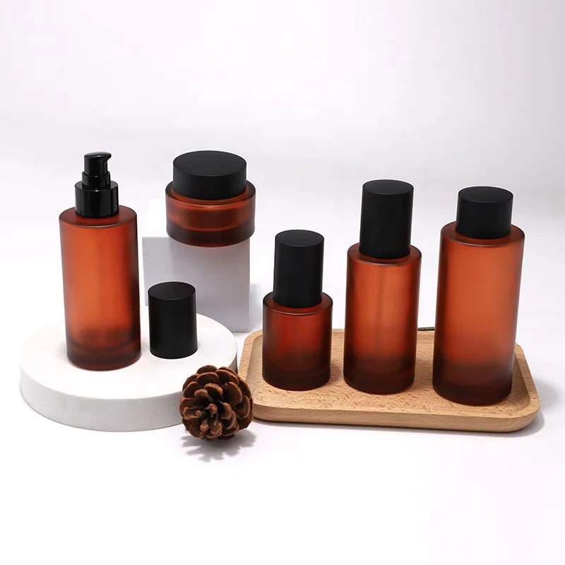 New Arrival Cosmetic Skincare Packaging Lotion Pump Bottle and Cream Jar Oil Dropper Toner Glass with Brown Frosted Amber Color