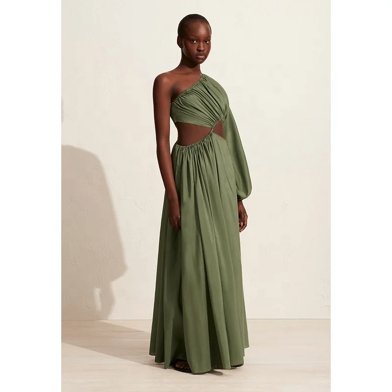 Women asymmetric full-length dress with bold waist cut-outs and a single voluminous long sleeve organic cotton maxi dress