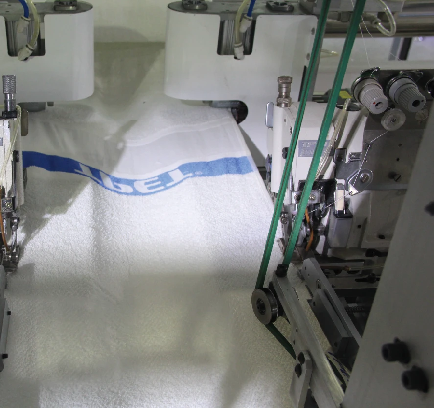 AUTOMATIC TERRY TOWEL LENGTH HEMMING MACHINE