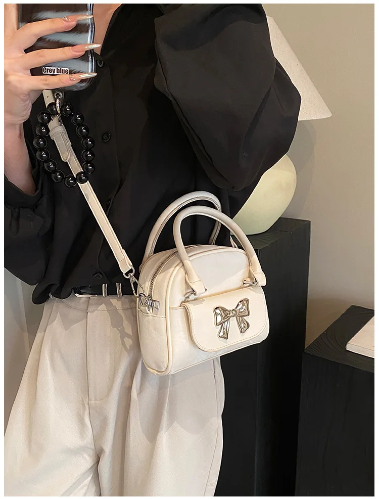 Luxury brand Korean version minimalist i fashionable bow high-end feeling 2024 new single shoulder crossbody saddle bag