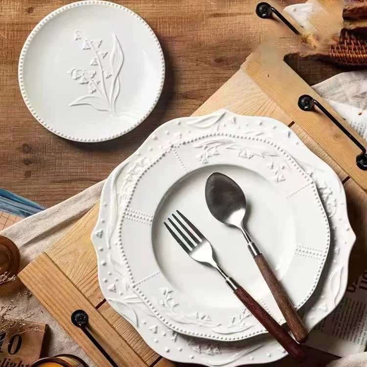 Wholesale Irregular Retro Handmade Glazed Three Dimensional Relief Bell Orchid Nordic Matte White Dessert Ceramic Dinner Plates