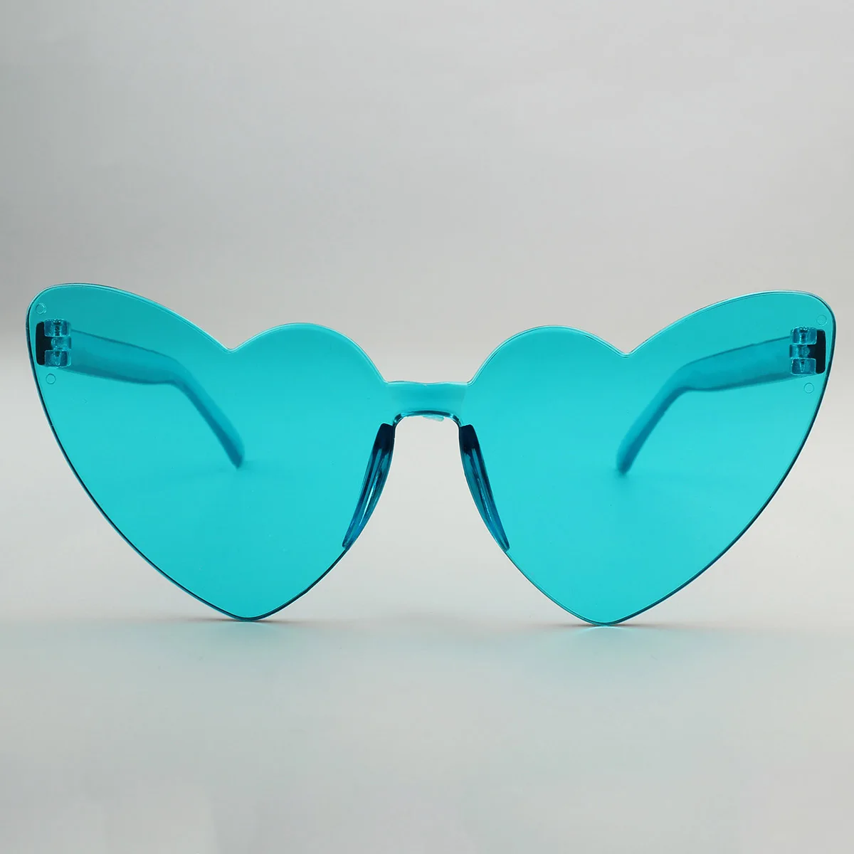 Wholesale Custom Frameless Lens Eyewear Candy Color PC Rimless Sun Glasses Trendy Loving Heart Shape Sunglasses