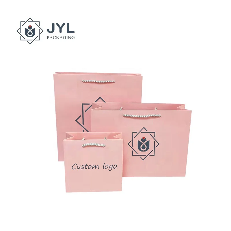 Manufacturer OEM Handmade UV Printing Pink Cardboard Ribbon Handles Customized Logo Cosmetics Paper Bags