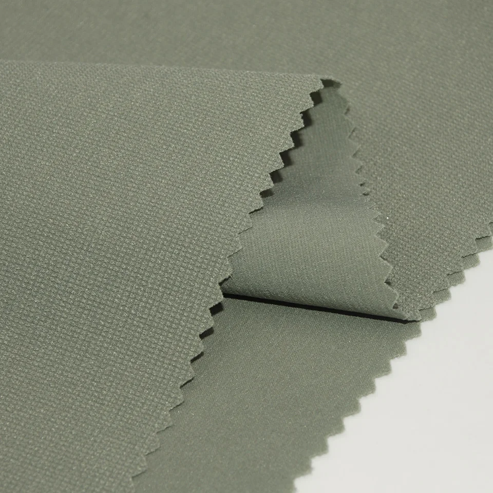 Outdoor sportswear Stocklot 160gsm plain dyed dobby style weave woven 4 way stretch 90 nylon 10 spandex fabric