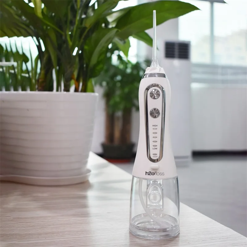 8 Years factory oem ipx 7 waterproof portable dental water jet teeth water flosser oral irrigator for home commercial travel use