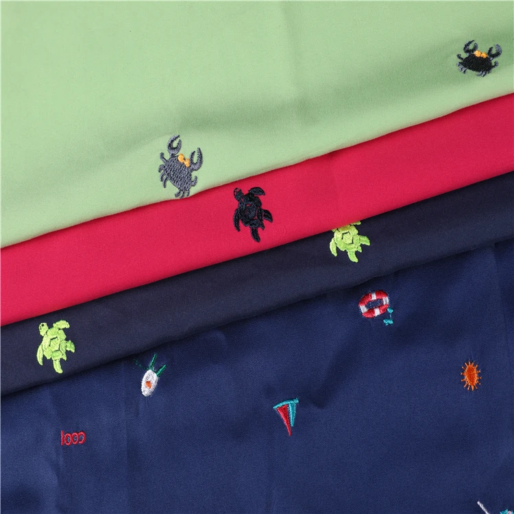 
100% polyester 75D*150D twill microfiber peach skin embroidered beach shorts fabric 