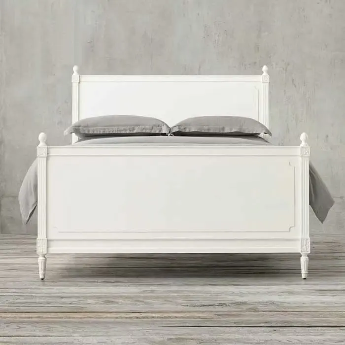 Custom furnished French style bedroom with large solid wood bed