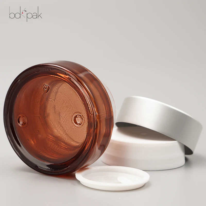 Wholesale ECO Friendly Reusable Jar for cream 1oz 2oz 30g 50g 100g Atter Shoulder UV Frosted Brown Clear Glass Cosmetics Jar 20g