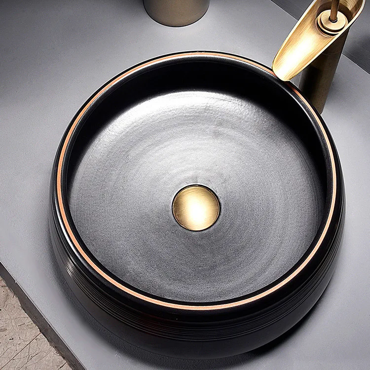 China Artistic Handmade Ceramic Wash Basin Round Counter Top Porcelain Sinks Carved Black Bathroom Sinks