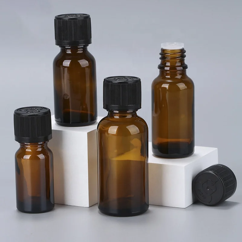 Wholesale amber cosmetic packaging 10ml 15ml round glass essential oil bottle boston glass reagent bottle with caps