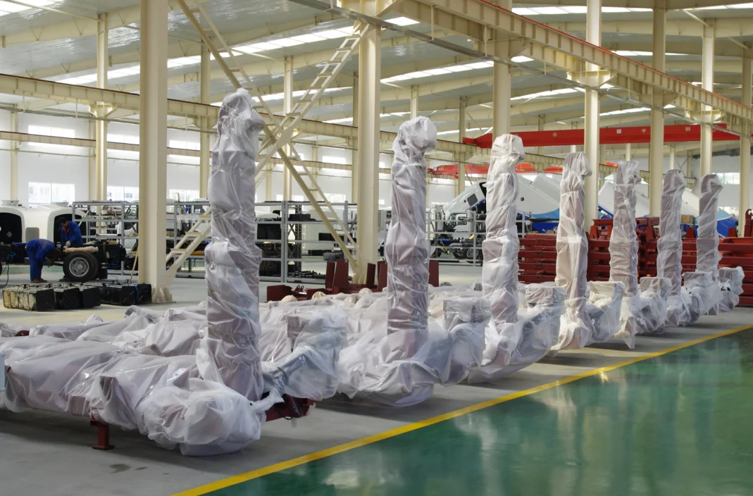 Hydraulic hook lift hoist mounted on heavy duty trucks designed for  transportation of materials in the waste, recycling, scrap