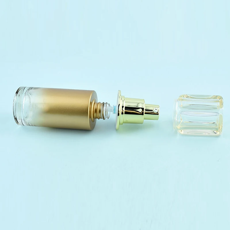 wholesale customize 40ml 30g 50g  gradient golden color glass bottle with  transparent cap and light golden pump