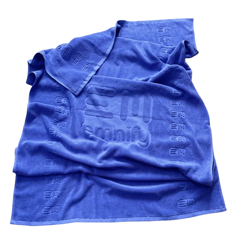 Embossed cotton beach towel with jacquard logo