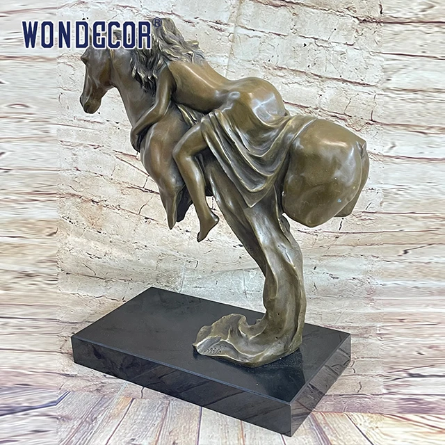 A copper sculpture of a young girl on a large metal art horse back outdoors