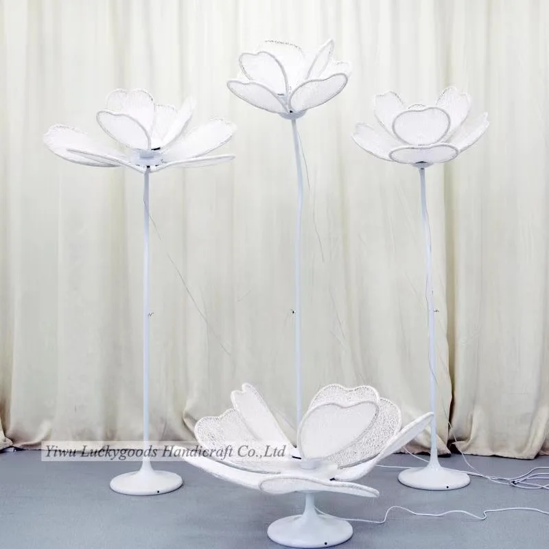 The wedding party is decorated with large flowers and lanterns