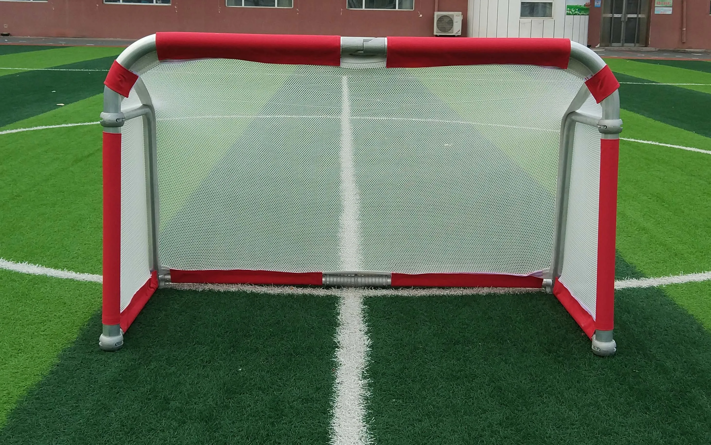 4 ft Kid using foldable mini aluminum portable soccer goal