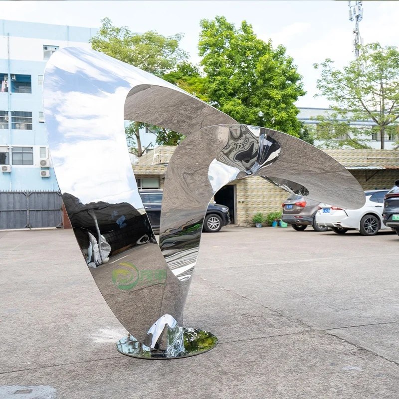 Large stainless steel sculpture in the park business square