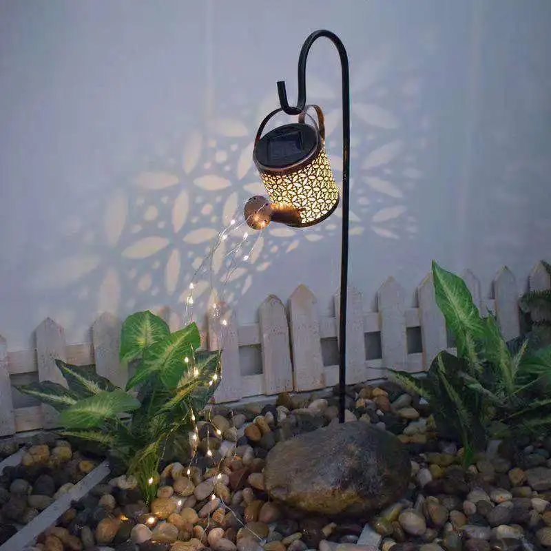 The new courtyard iron art hollow kettle shower water lamp waterproof solar lawn holiday landscape decoration lamp