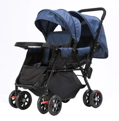 Twin baby strollers sit in front of and behind a portable reclining stroller