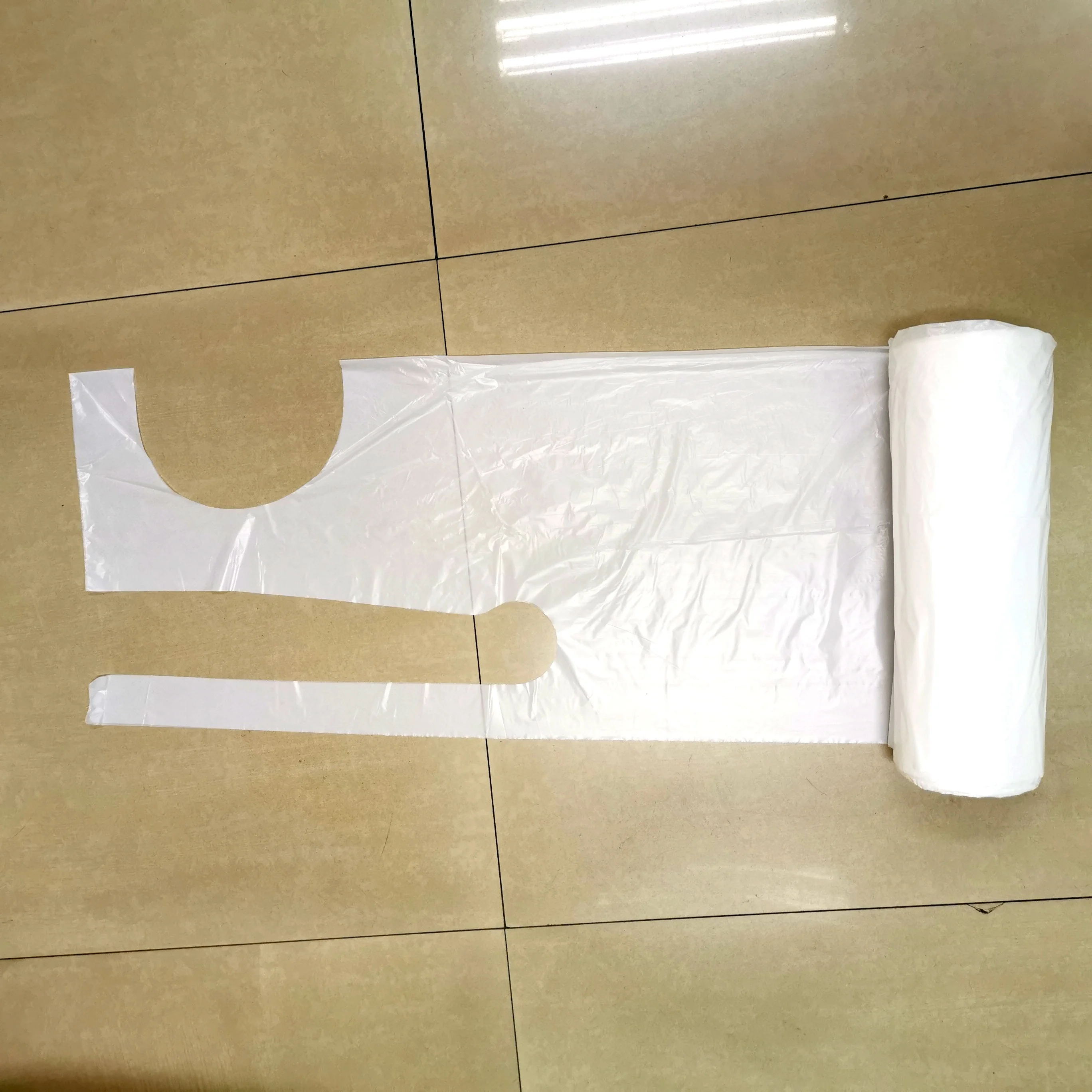 
Hospital Restaurant Household White Disposable Plastic Apron Sleeveless Apron Customized 