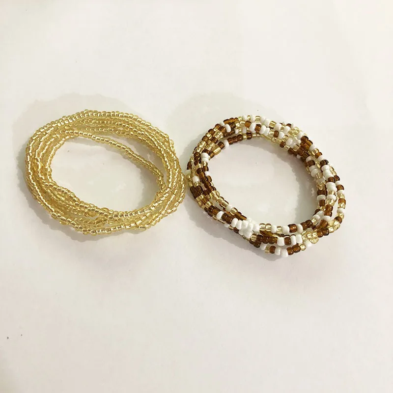 
2 PCS /Set simple beach rice beaded waist chain bikini chain belly manual rice bead elastic rope waist chain women bracelet 