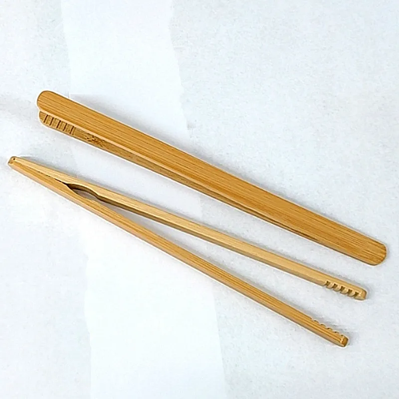 straight Tea with ebony chicken wings Wooden teacup with tea pliers Bamboo and wood tea tools