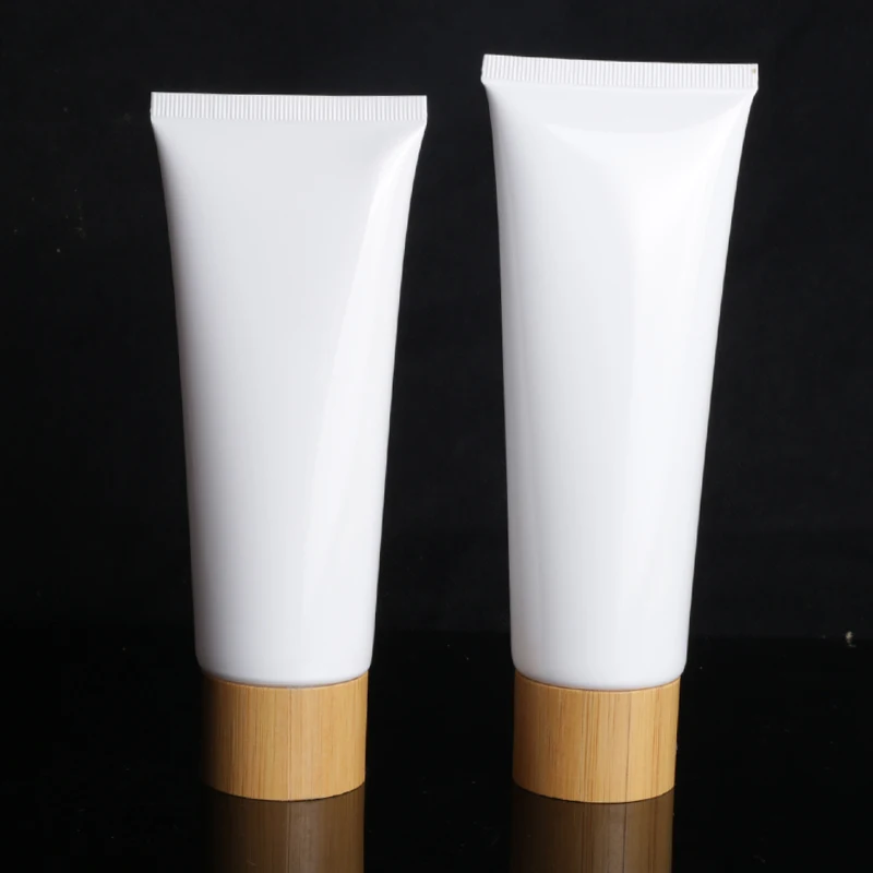 Wholesale 50g 80g 100g Skin Care Packaging bamboo cover white Plastic Cosmetic face cream tubes with bamboo screw lid in store
