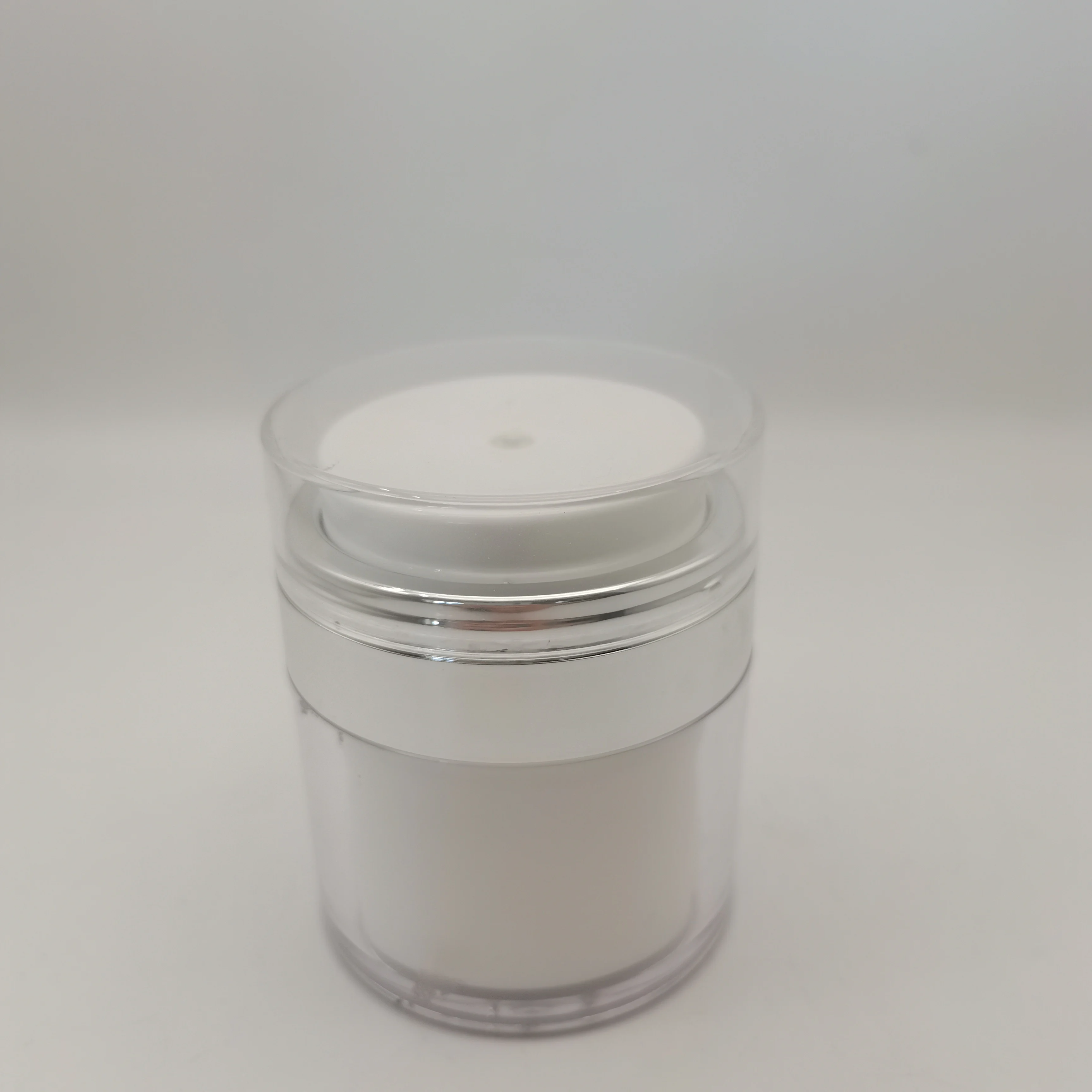 Wholesale colorful acrylic material pressing vacuum cream lotion bottle cosmetic bottle